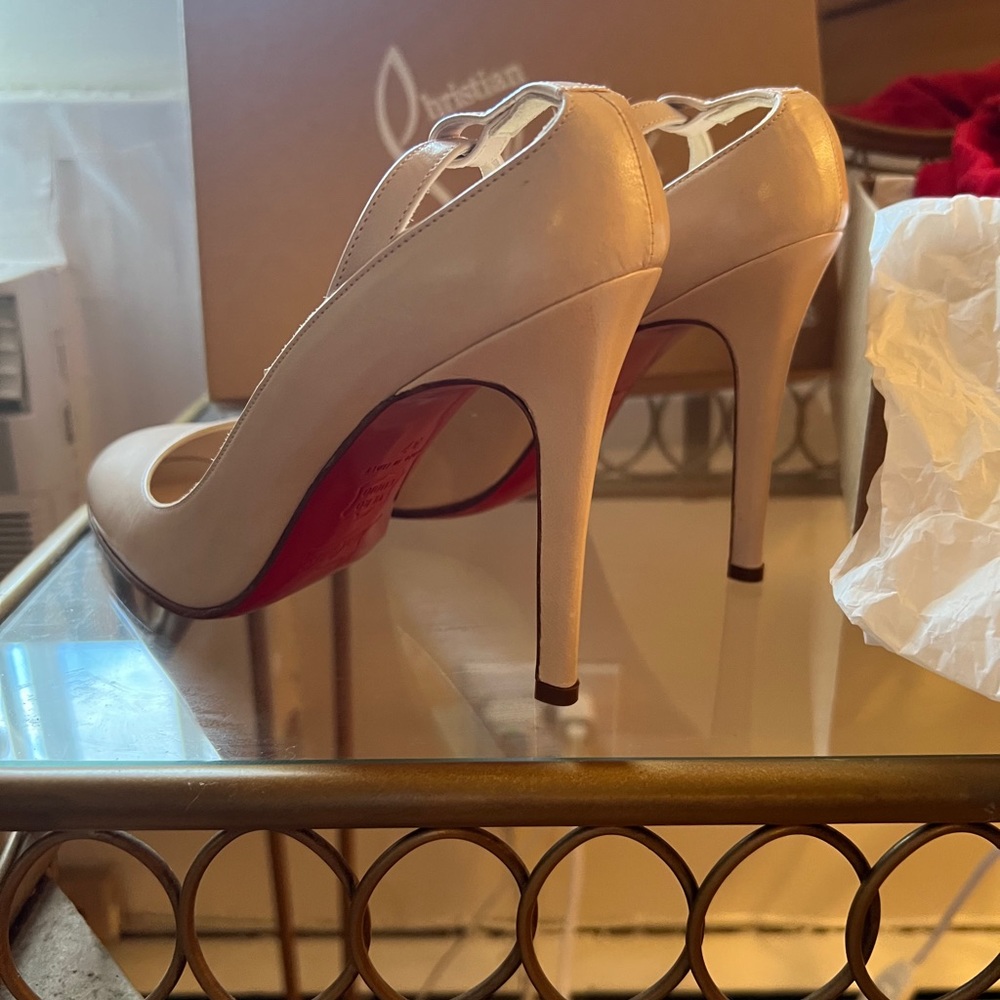 Blush Christian Louboutin pumps with ankle strap